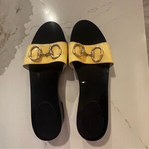 Vintage Gucci Yellow Patent Slide Sandals with Gold Horsebit Detail.